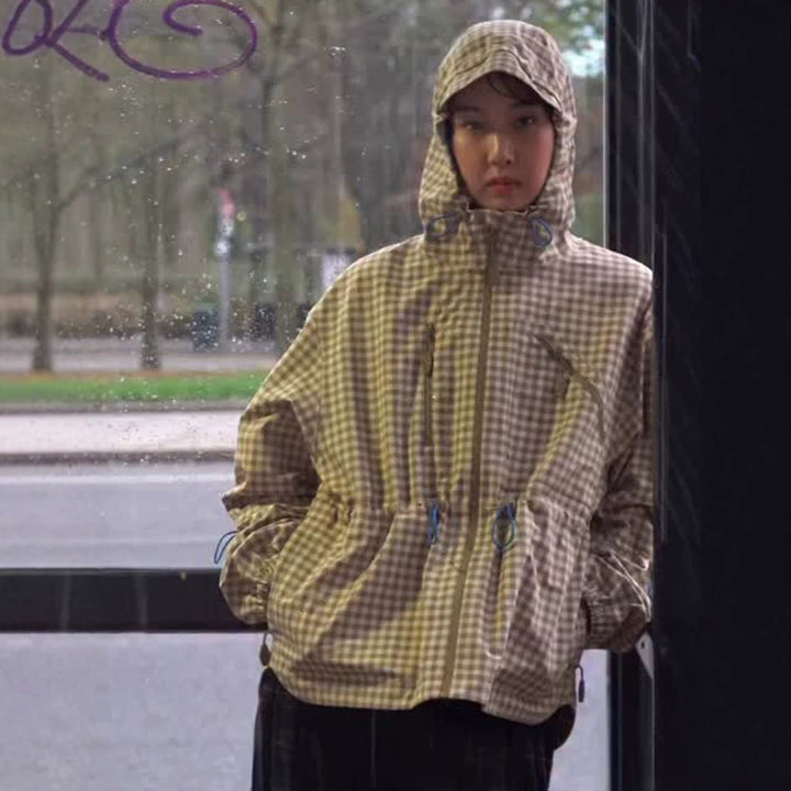 Damen Karo-Windbreaker mit Taillenzug, Kapuze und Reißverschluss Echoarchiv