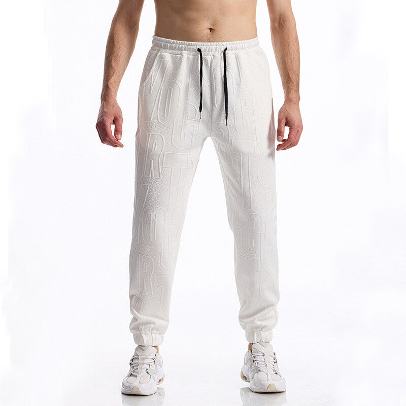 Herren Jogginghose mit elastischem Bund, Tunnelzug und geprägtem Allover‑Logo‑Relief Echo Archiv