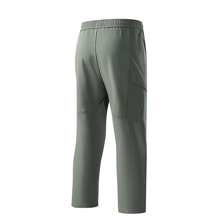 Herren Technische tapered Trainingshose mit elastischem Bund, 4‑Wege‑Stretch und Reißverschlusstaschen Echo Archiv