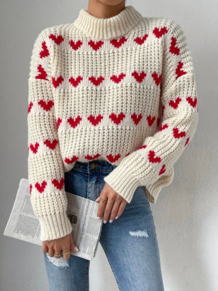 Damen nan Grobstrickpullover mit eingestrickten Herzmotiven, hohem Stehkragen und lässiger Oversize-Silhouette Echo Archiv