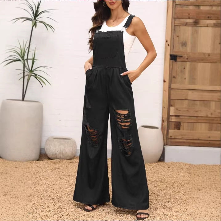 Damen weite Distressed-Latzhose mit verstellbaren Trägern und großen Knie-Rips Echo Archiv