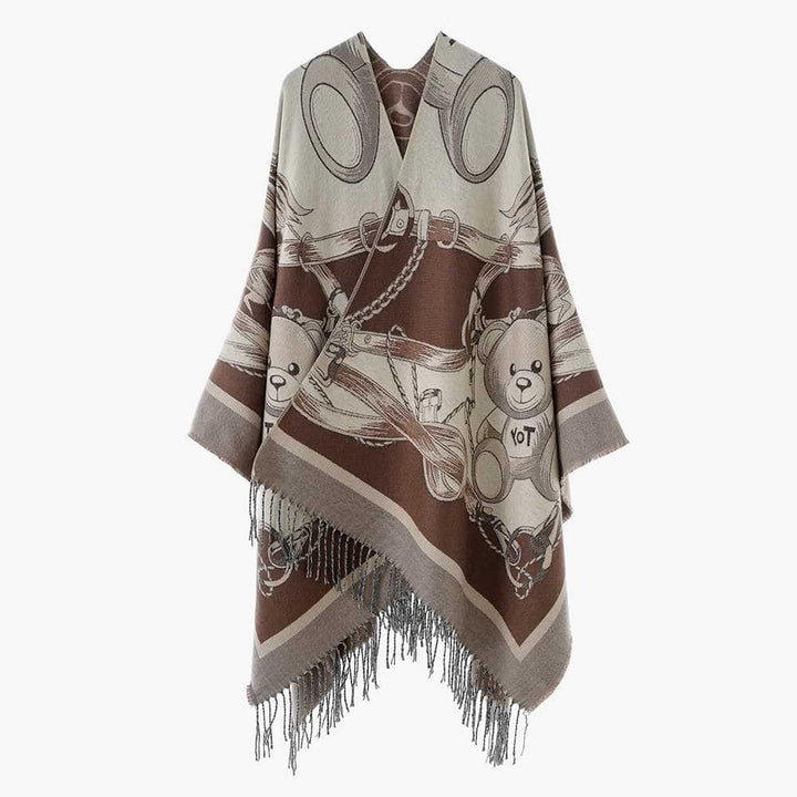 Damen Jacquard-Poncho mit Fransen und illustrativem Teddy-Sattel-Motiv – Avérine