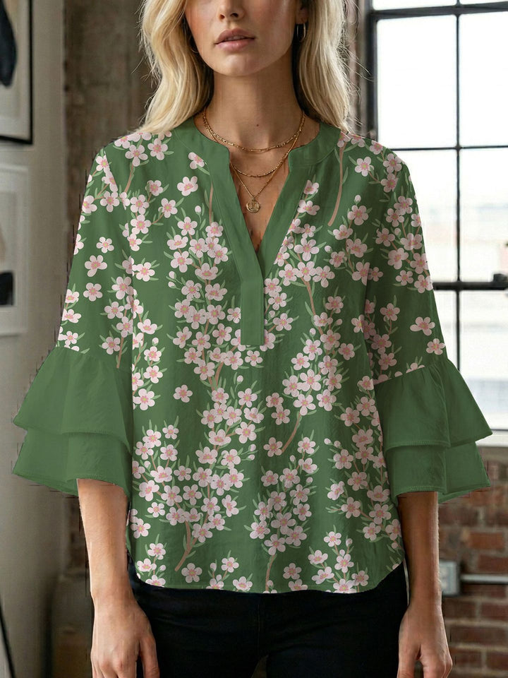 Damen Blusenshirt mit voluminösen Ärmeln und kreativem Druckdesign Echo Archiv