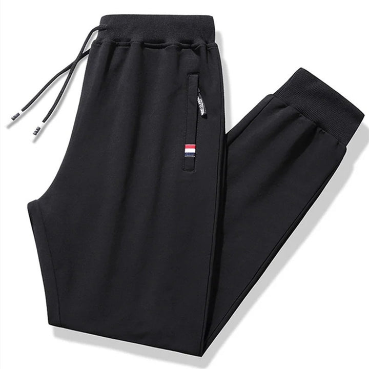 Herren Tapered-Jogginghose mit Tunnelzug, Reißverschlusstasche & Rippbündchen Echo Archiv