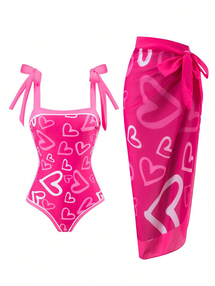 Damen Eleganter Badesuit mit floralen Akzenten und modischem Wickelrock Echo Archiv