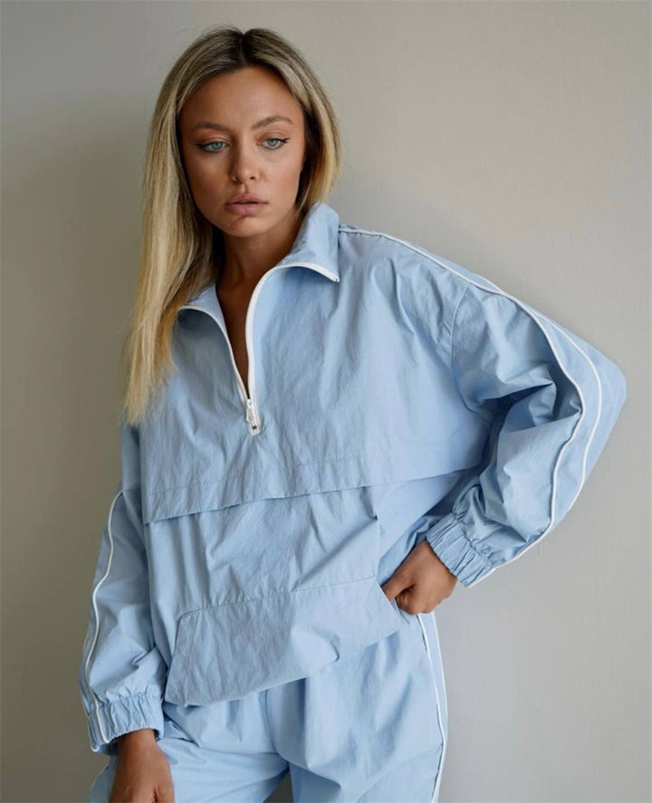 Damen leichtes Half-Zip Windbreaker-Oberteil mit Kängurutasche, elastischen Bündchen und seitlicher Paspel – Auréline