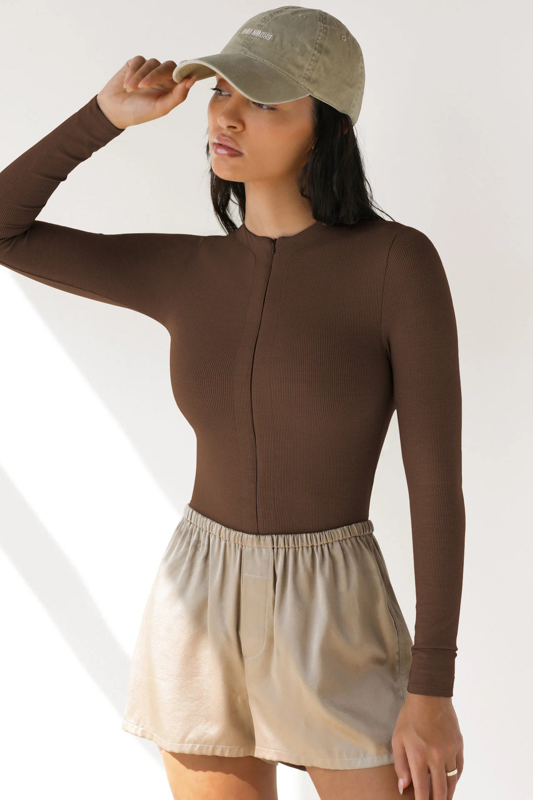 Damen Langarm-Bodysuit mit Reißverschluss Echoarchiv