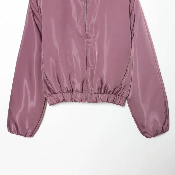 Damen Glänzende Cropped Bomberjacke mit Stehkragen und elastischem Bund Echo Archiv