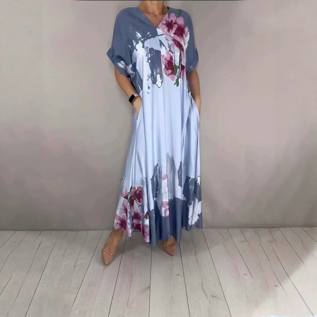 Damen Maxikleid mit weitem Fall, V-Ausschnitt, Eingrifftaschen und floraler Aquarelloptik Echoarchiv