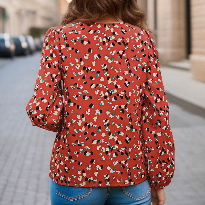Damen Locker geschnittene V-Ausschnitt-Bluse mit kontrastierter Zierblende und Allover-Print Echoarchiv