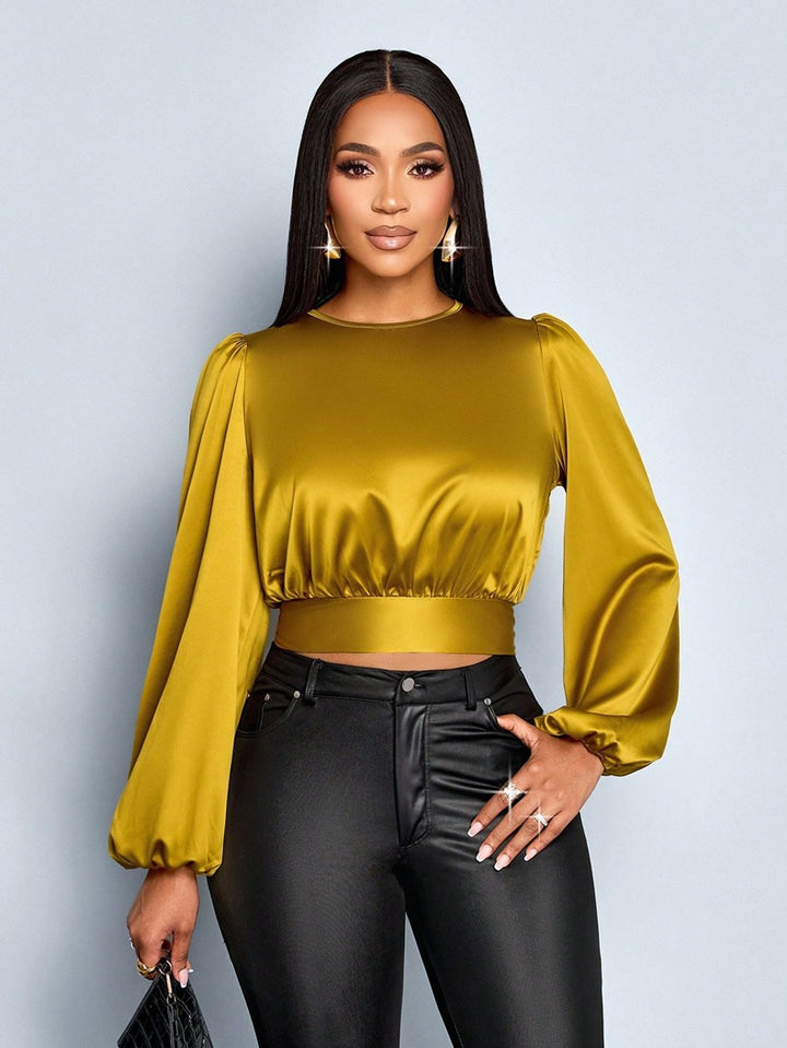 Damen Elegant geschnittene Leoparden-Bluse mit Dekolleté und Schleifenrand Echo Archiv