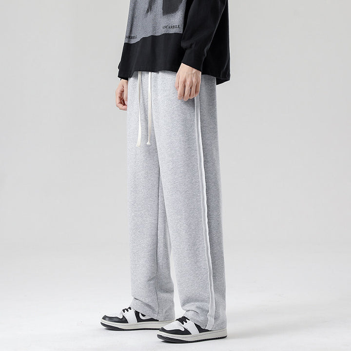 Herren weite Jogginghose im Oversize-Schnitt mit Seitenstreifen, Kordelzug & Fleecefutter Echo Archiv