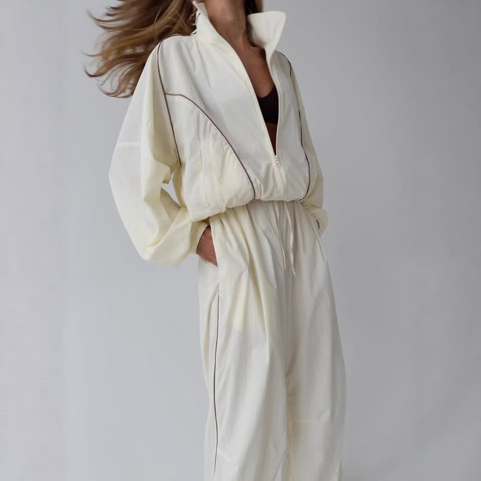Damen leichter Windbreaker-Zweiteiler mit Stehkragen, durchgehender Reißverschluss, kontrastierender Kedernaht und weiter Palazzo-Hose – Élanora
