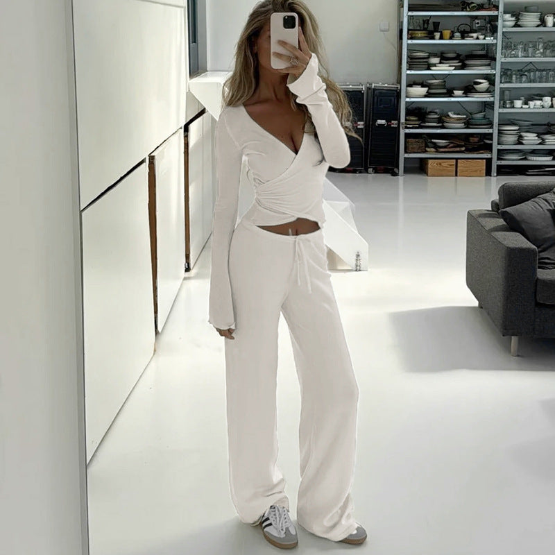 Damen nan Wickel-Cropped-Top mit tiefem V‑Ausschnitt, taillierter Wickelform und langen Glockenärmeln Echo Archiv