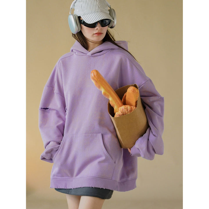 Damen Oversized-Hoodie mit Used-Optik und Riss-Details Echoarchiv