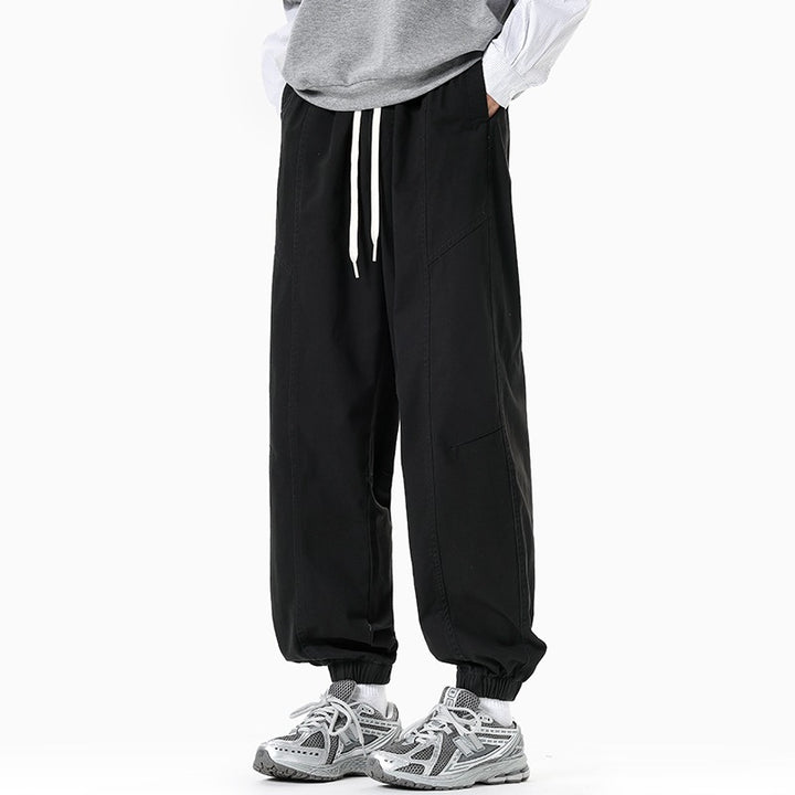 Herren Oversized Utility-Jogginghose aus robustem Baumwollmix mit Kordelbund, seitlichen Cargo‑Taschen & gerippten Bündchen Echoarchiv