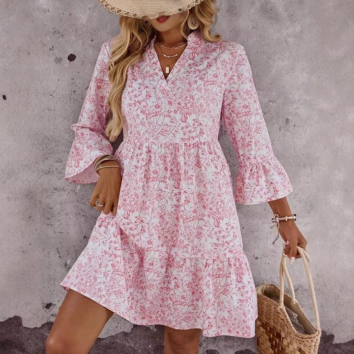 Damen Florales Babydoll-Kleid mit V-Ausschnitt, hohem Empire‑Bund und Glockenärmeln Echo Archiv
