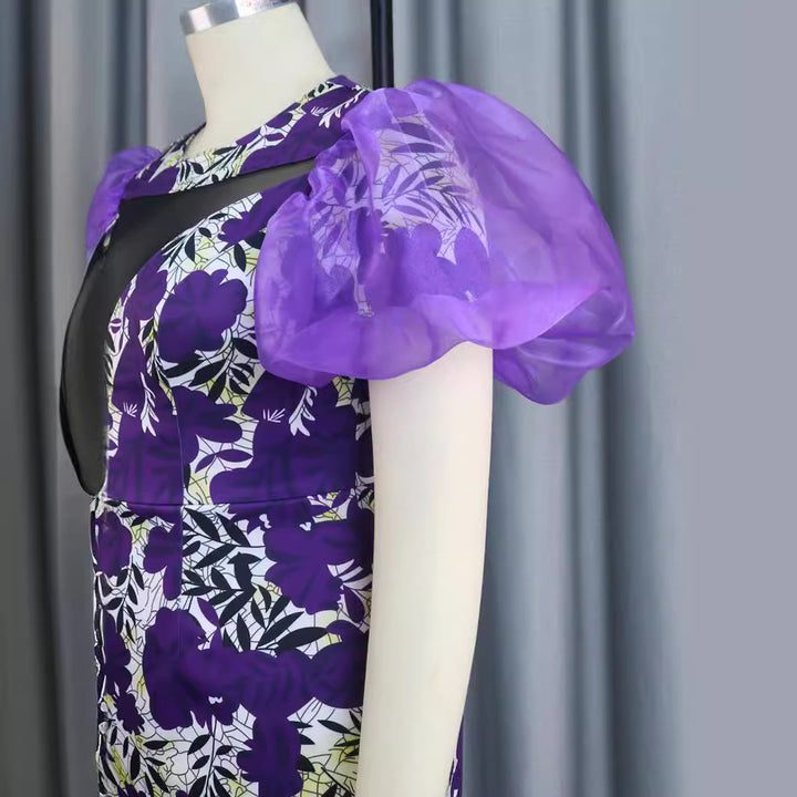 Damen extravagantes Cocktailkleid mit voluminösen Puffärmeln und floralem Muster Echo Archiv
