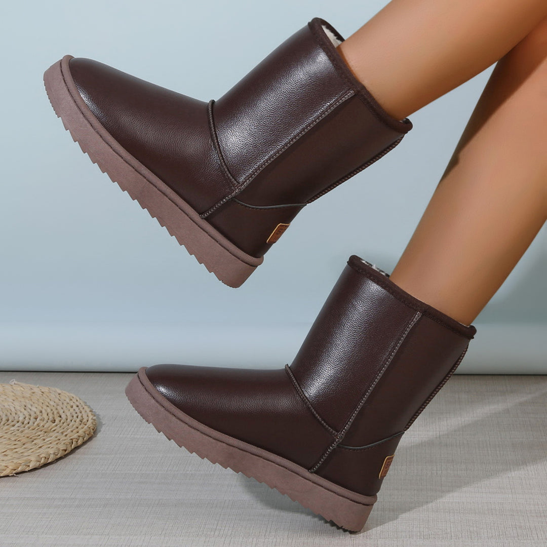 Damen Winterstiefel mit Teddyfutter, Lederoptik und flacher Plateau‑Sohle Echoarchiv