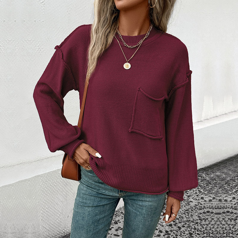 Damen Oversize Rundhals-Strickpullover mit aufgesetzter Brusttasche und fransiger Saumnaht Echoarchiv