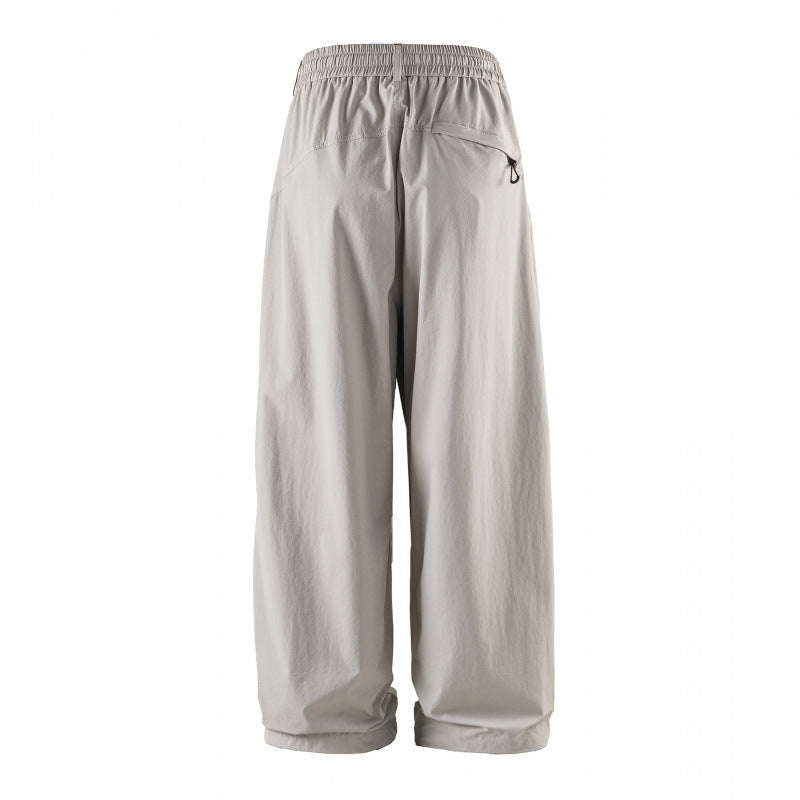 Unisex Weitgeschnittene technische Cargo-Hose mit Gummibund, Kordelzug und Reißverschlusstaschen Echo Archiv