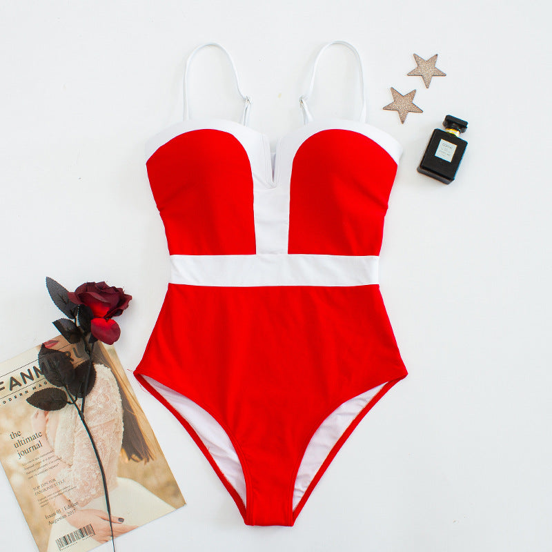 Damen Eleganter Einteiler Badeanzug mit tiefem V-Ausschnitt und kontrastierenden Details Echo Archiv