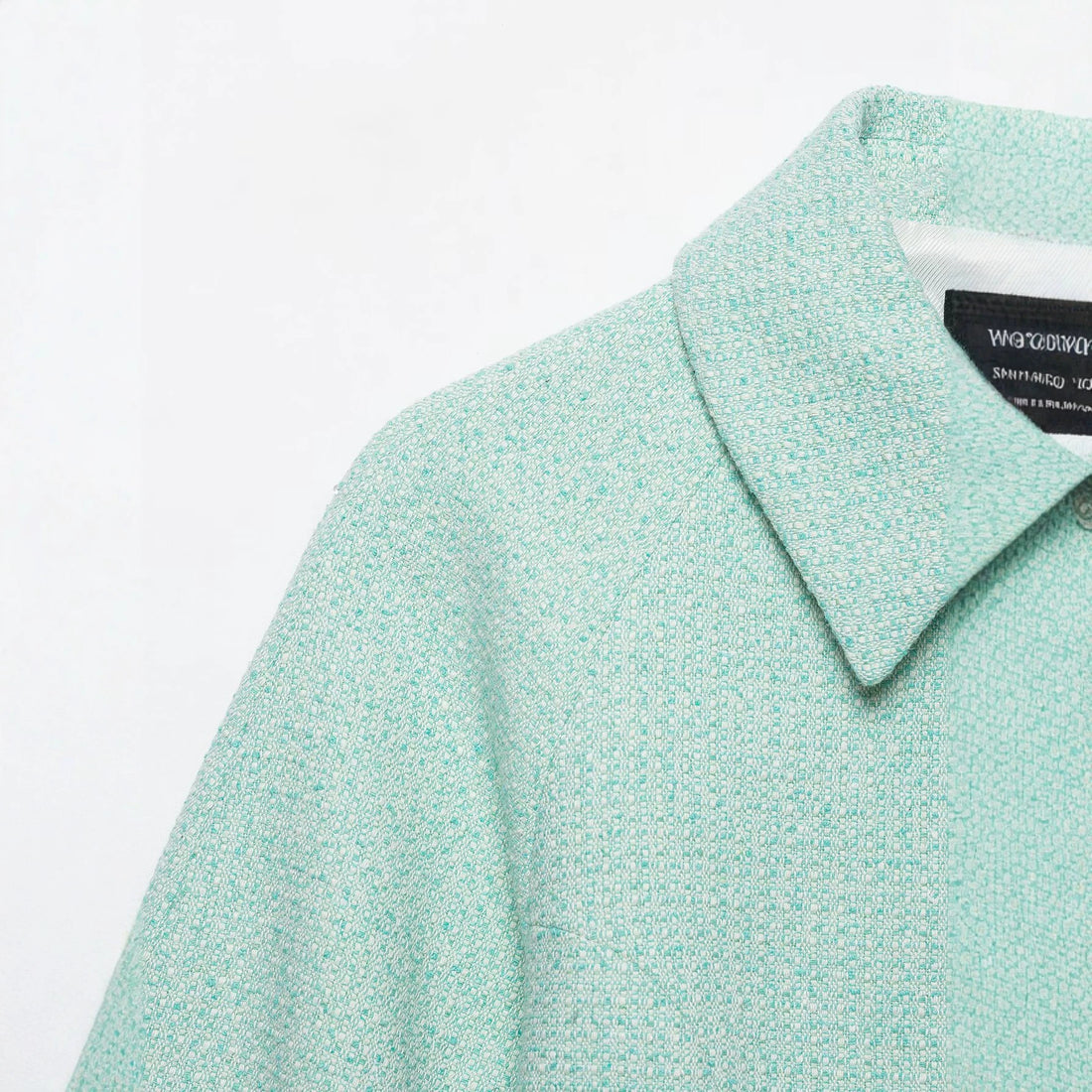 Damen Kurzblouson aus Bouclé mit verdecktem Reißverschluss und Umschlagmanschetten Echo Archiv