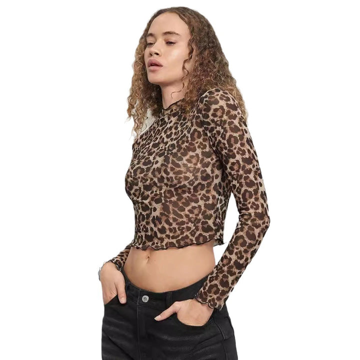 Damen nan figurbetontes bauchfreies Langarmshirt im Animalprint aus feinem Stretchnetz mit Stehkragen und Wellensaum Echo Archiv