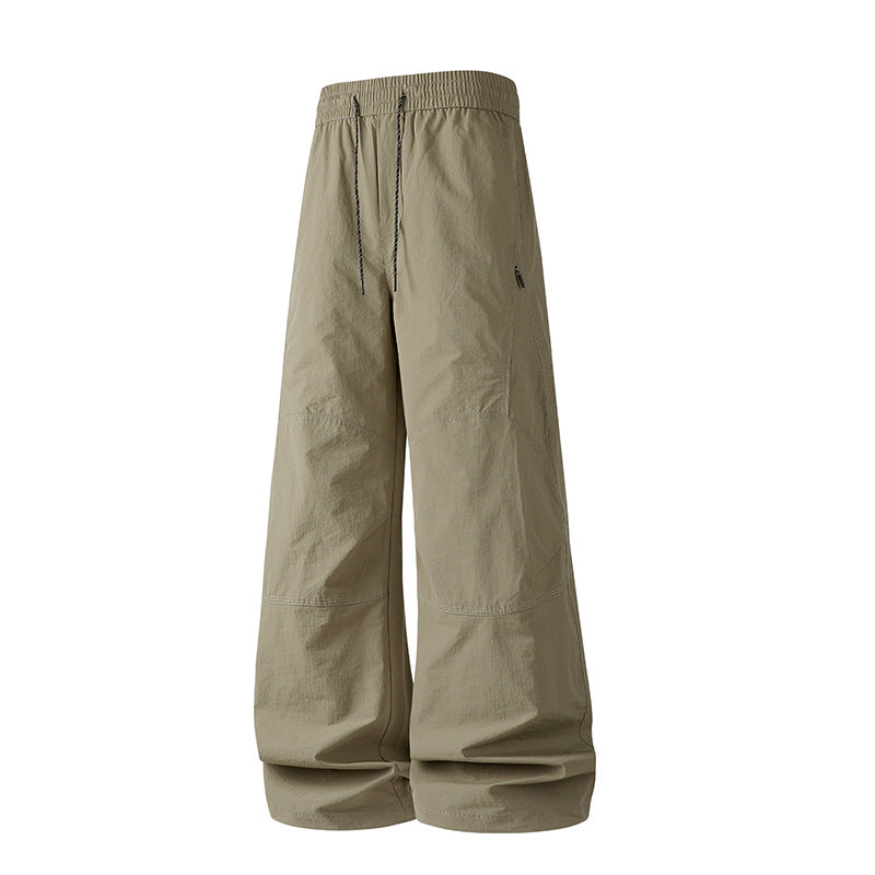 Herren Weite Baggy‑Hose mit Tunnelzugbund und Paneel‑Konstruktion Echo Archiv