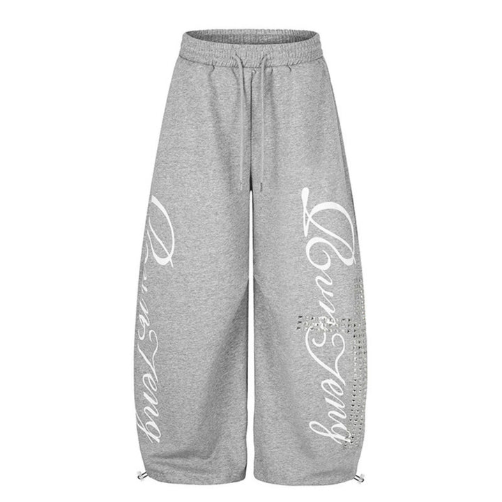 Damen Palazzo-Sweatpants im Culotte-Stil mit hohem Bund, Tunnelzug, Schriftprint und Strassbesatz Echoarchiv