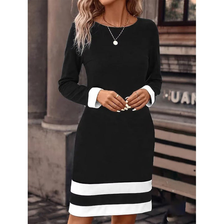 Damen Elegantes Kleid mit kontrastierenden Ärmelabschlüssen und Saum Echoarchiv