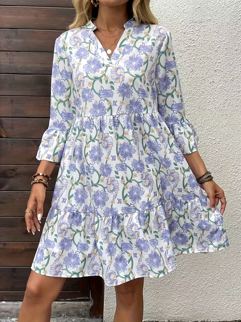 Damen Florales Babydoll-Kleid mit V-Ausschnitt, hohem Empire‑Bund und Glockenärmeln Echo Archiv