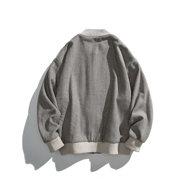 Unisex Boxy-Bomberjacke im Fischgrät-Look mit Rippbündchen, Pattentaschen und verdeckter Druckknopfblende Echo Archiv