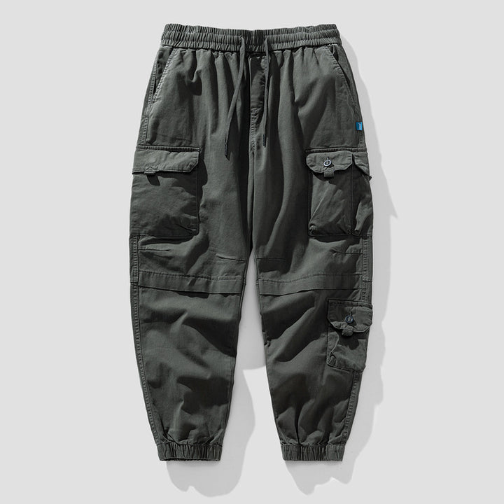 Herren Leichte Canvas-Cargohose im Joggerstil mit elastischem Bund, segmentierten Kniepaneelen und verdeckten Klappentaschen Echo Archiv