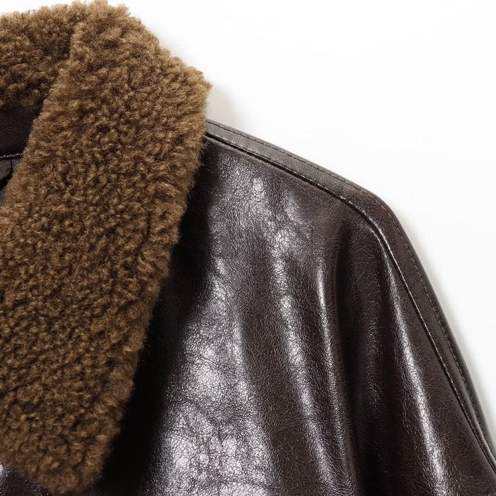 Damen Oversized Lederimitat-Jacke mit Teddykragen und Taillengürtel Echoarchiv