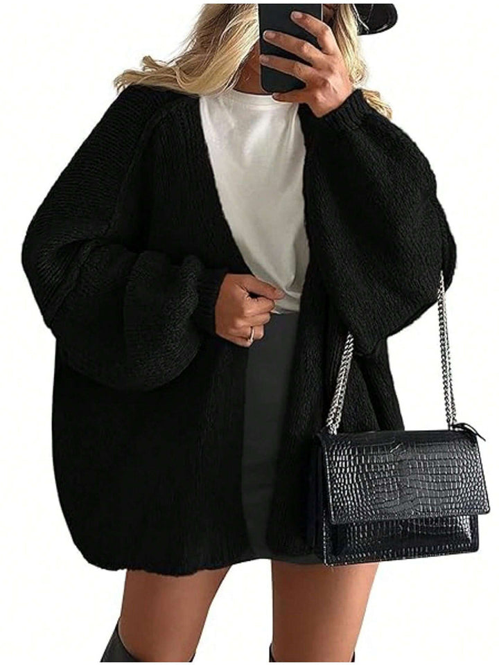 Damen Oversize Strickcardigan mit Ballonärmeln und offener Front Echoarchiv