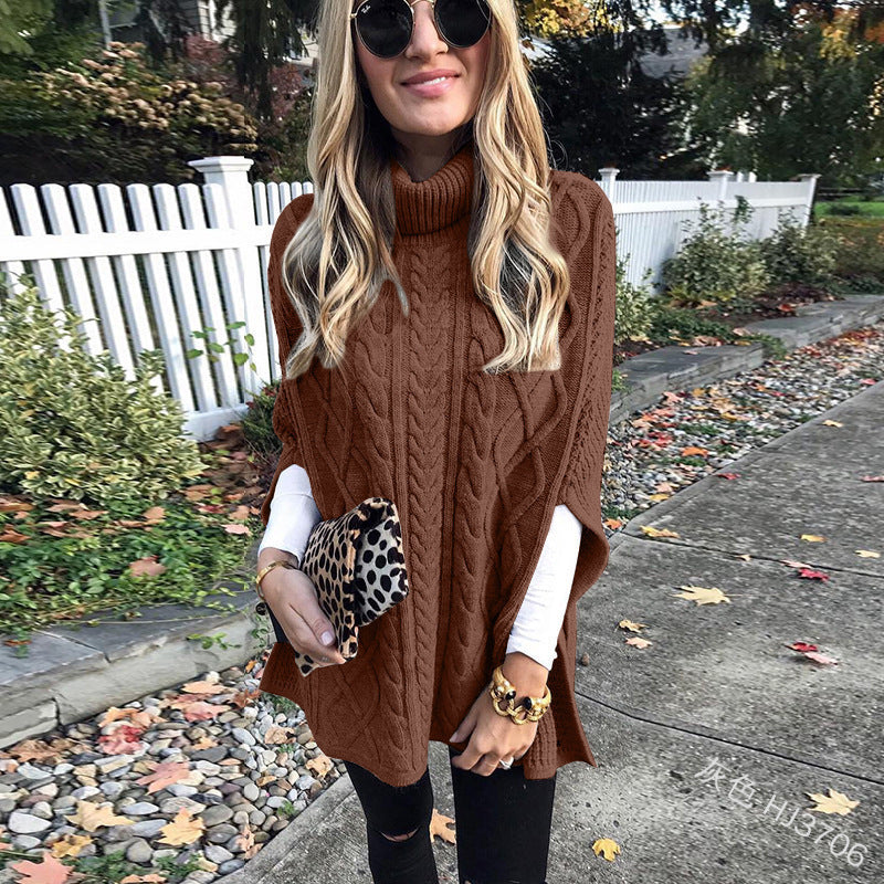 Damen nan kastiger Strickponcho mit hohem Rollkragen, Zopfstruktur und seitlichen Schlitzen Echo Archiv
