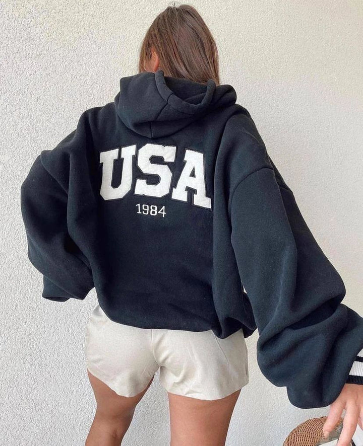 Damen Kurz geschnittener Oversize-Kapuzenpullover mit aufgenähter College-Applikation und gerippten Bündchen Echoarchiv