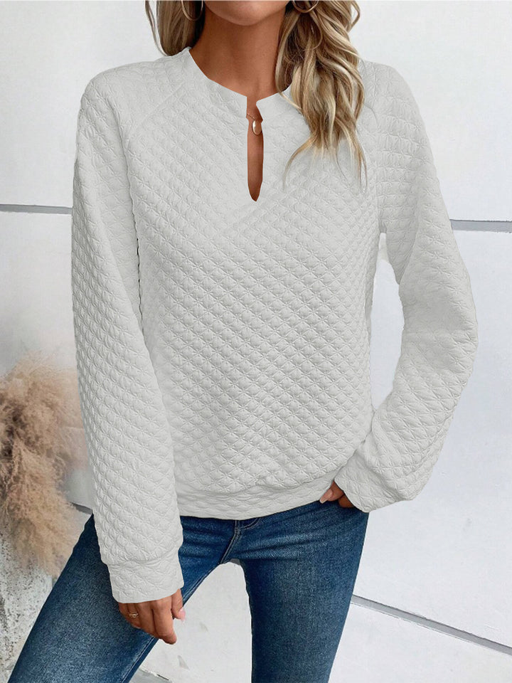 Damen Gestepptes Sweatshirt mit Schlitzkragen, Rautenstruktur und Raglanärmeln – Mavelle