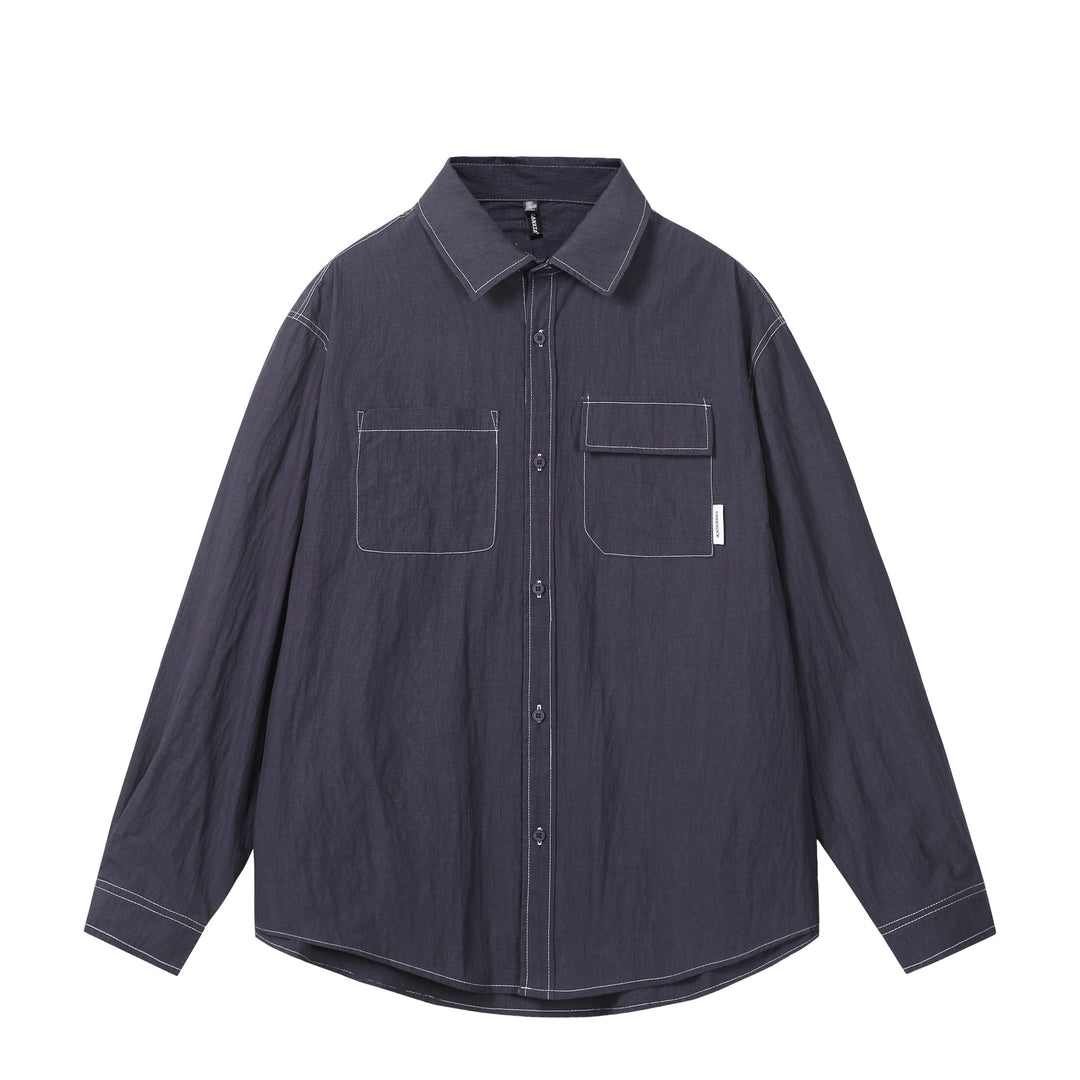 Unisex Oversize-Hemdjacke mit markanten Kontrastnähten und aufgesetzten Brusttaschen Echoarchiv