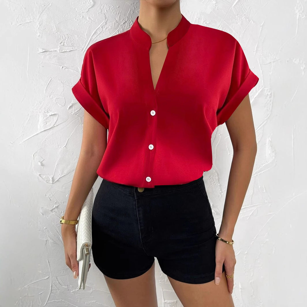 Damen Elegante Kurzarmbluse mit Stehkragen und subtilen Knopfdetails Echoarchiv