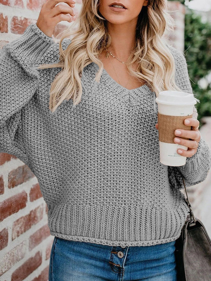 Damen Oversize Grobstrickpullover mit V-Ausschnitt und Rippsaum Echoarchiv