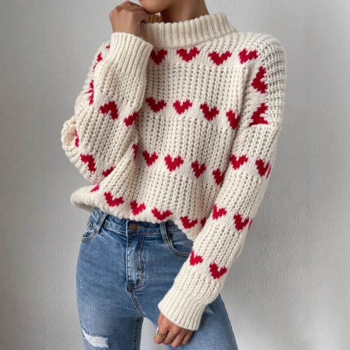 Damen nan Grobstrickpullover mit eingestrickten Herzmotiven, hohem Stehkragen und lässiger Oversize-Silhouette Echo Archiv