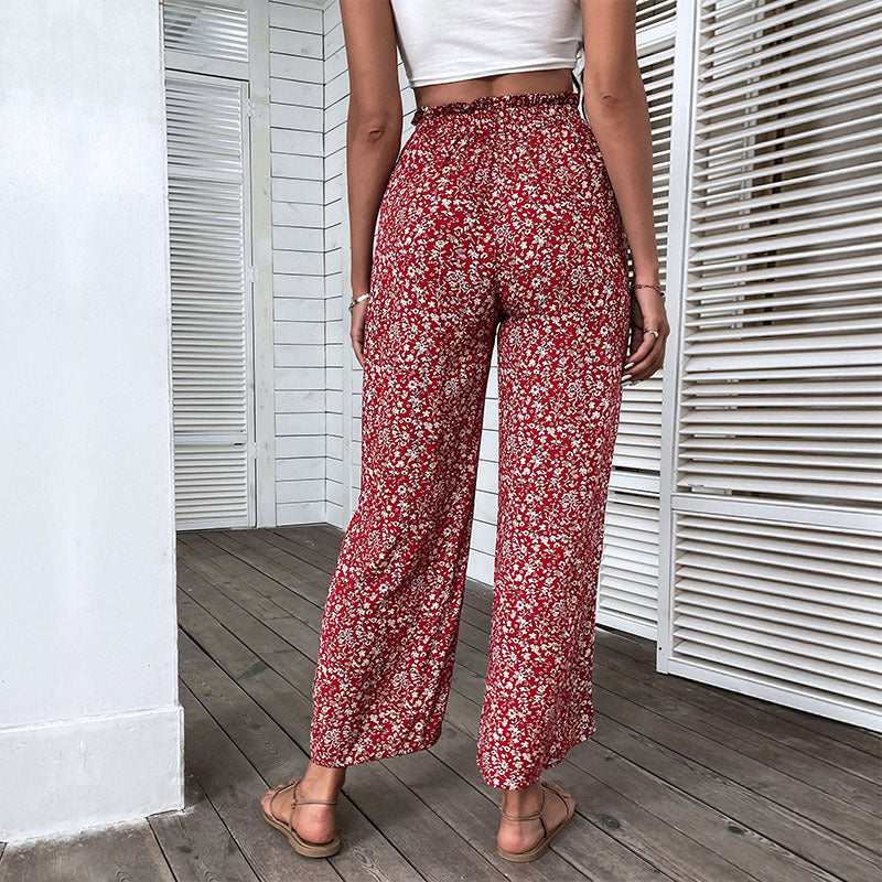 Damen Weite hochgeschnittene Palazzo‑Hose mit floralem Muster und seitlichem Beinschlitz Echoarchiv