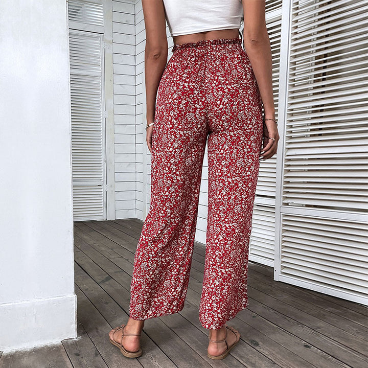 Damen Weite hochgeschnittene Palazzo‑Hose mit floralem Muster und seitlichem Beinschlitz Echoarchiv