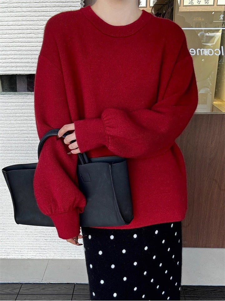 Damen Oversize-Feinstrickpullover mit Ballonärmeln und Knopfmanschette Echoarchiv