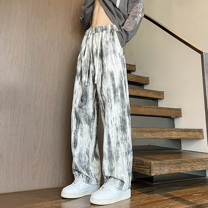 Herren Weit geschnittene Loungehose mit Marmorprint aus strukturiertem Jersey Echo Archiv