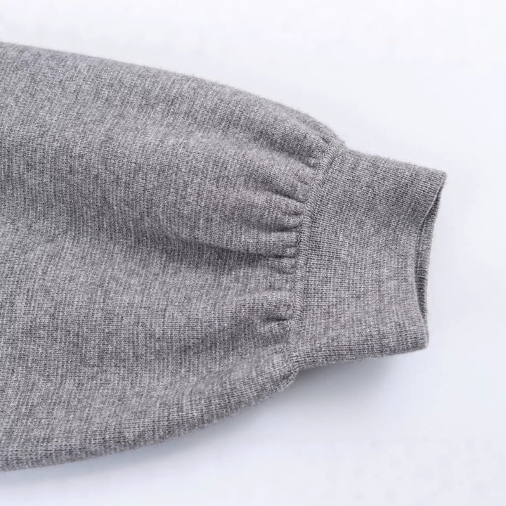 Damen Feinstrickpullover mit Tunnelzugtaillierung, Rundhals und Ballonärmeln Echoarchiv