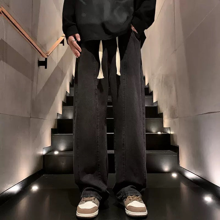Herren weite Denim-Hose im urbanen Stil mit lässigem Schnitt und bequemem Gummizug Echoarchiv