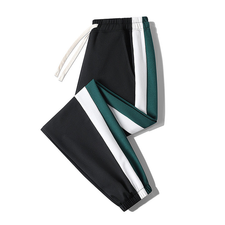 Herren Konische Trackhose mit Kordelzug, seitlichen Colorblock‑Streifen & elastischen Bündchen Echoarchiv